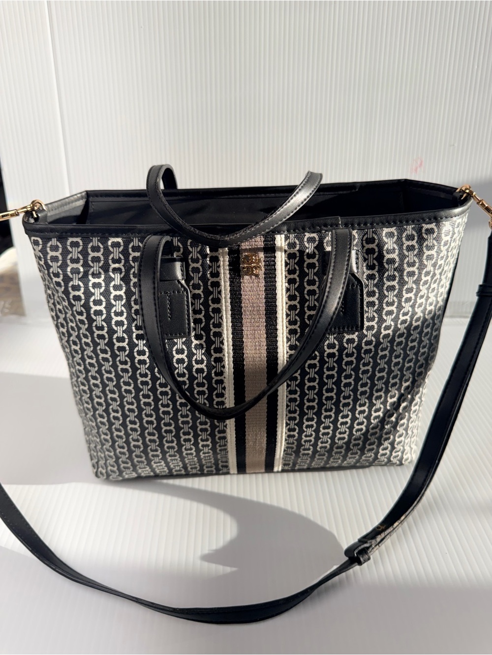 Tory Burch Gemini Link small canvas tote bag in black.
